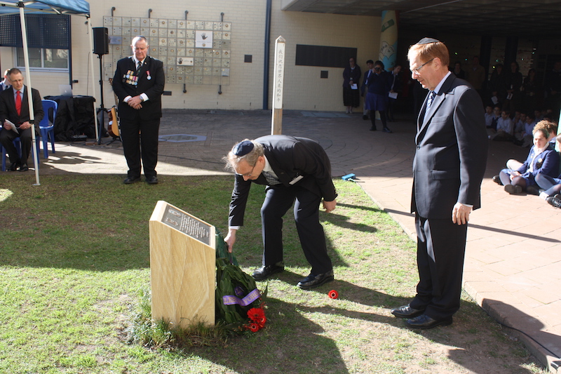 Peter Allen, National Co-ordinator of COAJP, with Roger Selby, laying a memorial wreath on the Anzac Memorial Cairn unveiled on 3 August 2015 at Masada College 