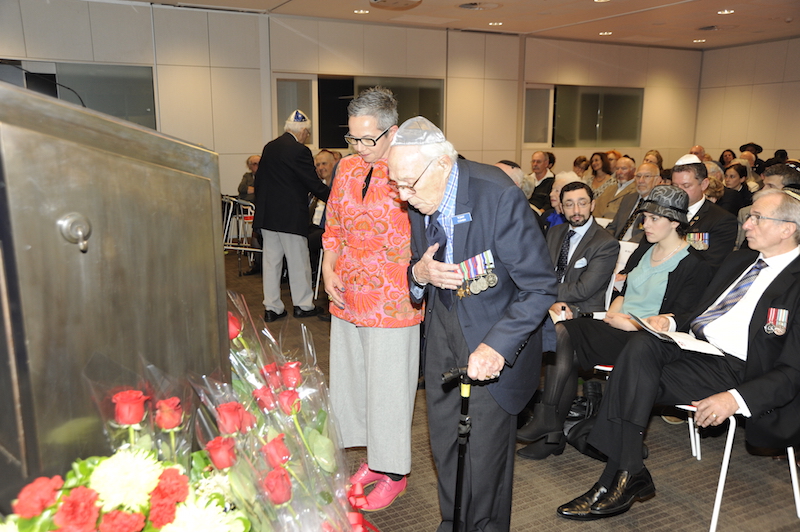 Tony Cohen with his daughter, Leone, laying a floral tribute (Photo taken by Alan Shaw for NAJEX)